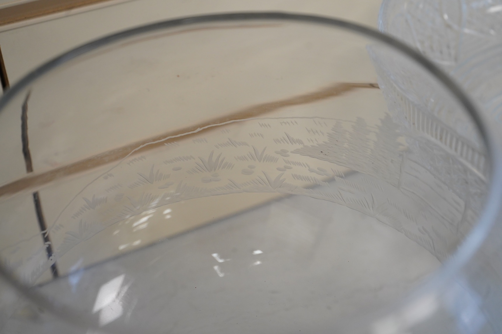 Two footed glass bowls engraved with racing and hunting scenes, an early 19th century oval cut glass fruit bowl, another, modern, together with a small Regency mallet shaped decanter, with an enamel label ‘’Whisky’’, (6)